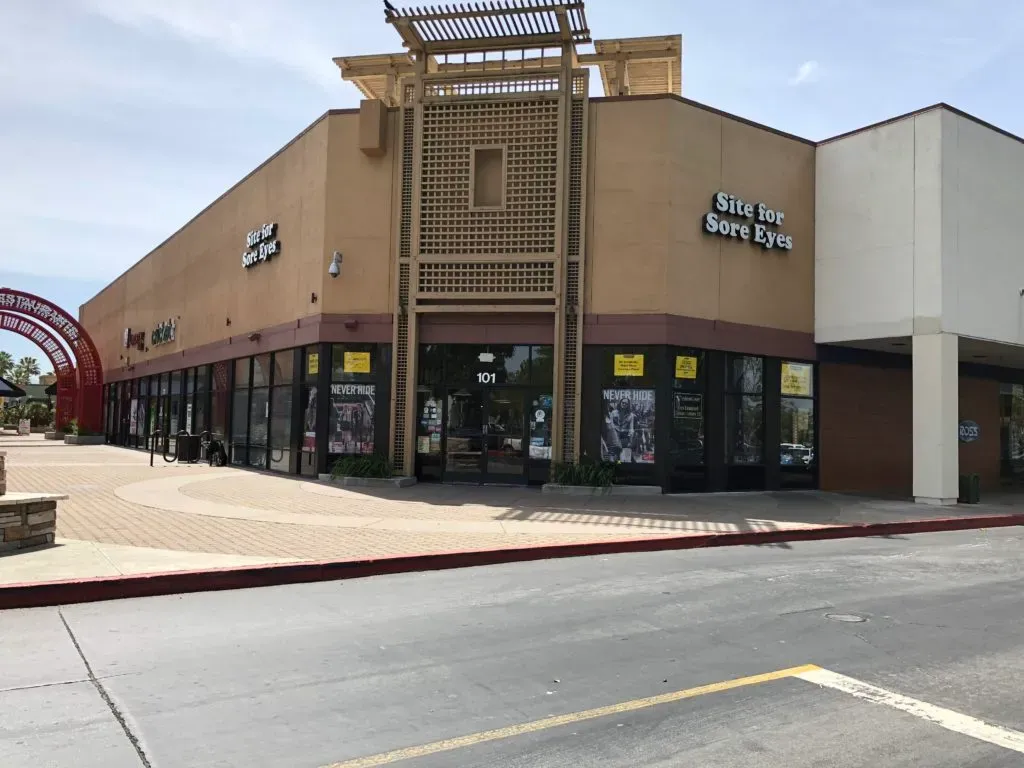Exterior view of the Site for Sore Eyes store in Fremont, showing the building facade with large windows and the company signage.